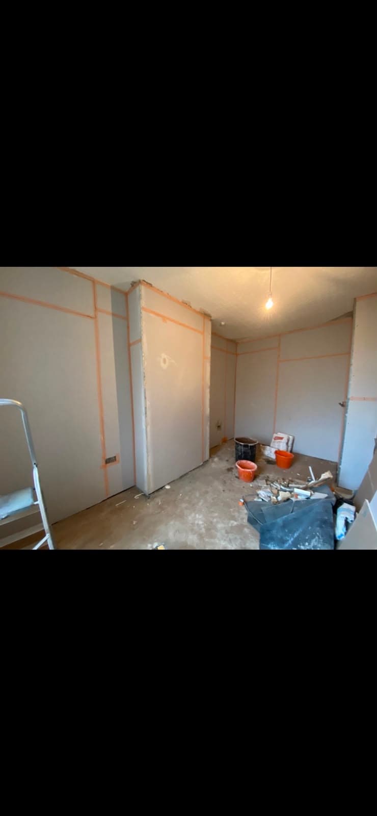 A freshly plasterboarded room with taped joints ready for skimming